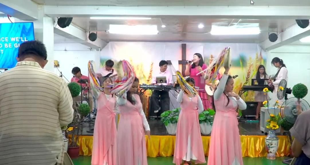 Congregation worshiping at Jesus Harvest Assembly of God